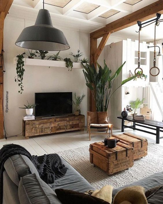 a modern living room with rustic touches - wood slab tables and a TV unit, wooden beams and a coffered ceiling