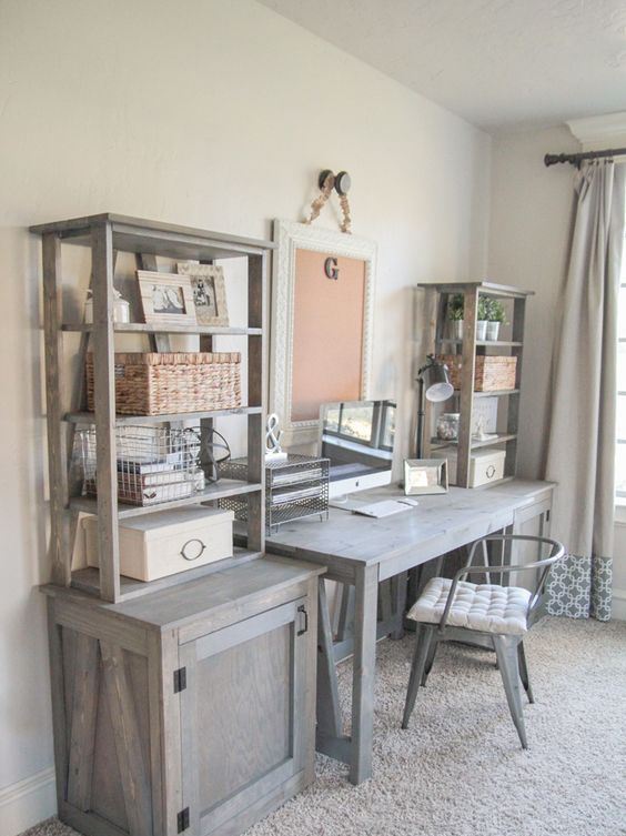 a rustic home office with pale furniture, open storage units, a metal chair for an industrial feel