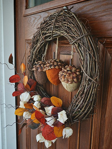 cute and inviting fall front door decor ideas Knitted acorns would look cozy in the center of a wreath.