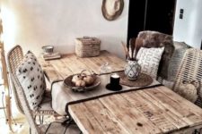 a boho rustic dining space with a rustic wooden table, wicker chairs, a basket for storage