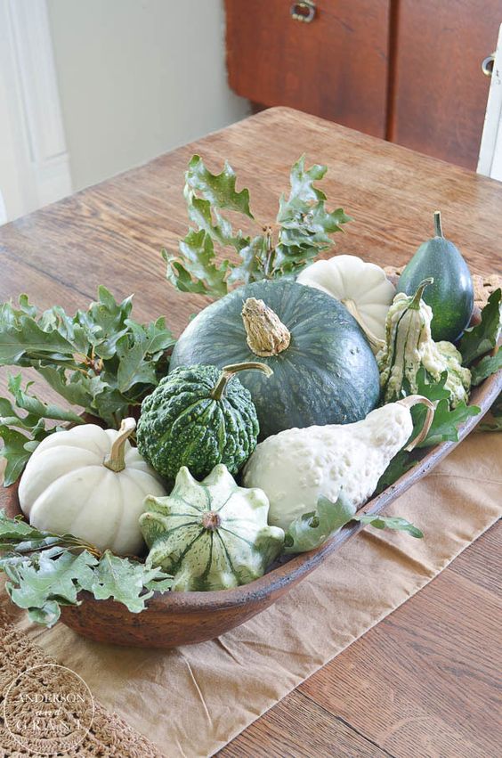 a wooden bowl with gourds and pumpkins, greenery is a simple and lovely fall centerpiece to go for
