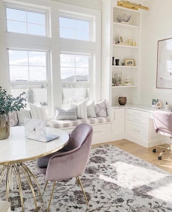 an airy neutral home office with lilac chairs, a printed rug, a windowsill daybed and storage units