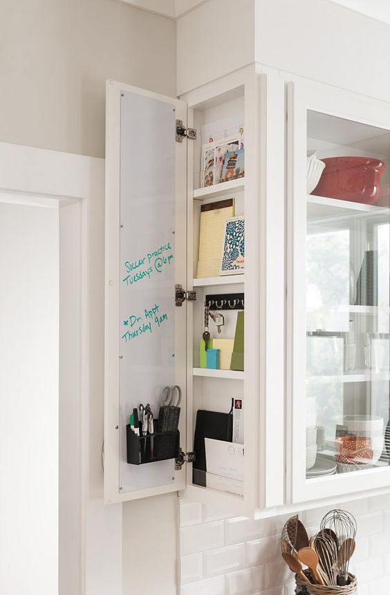 an elegant glass fronted storage cabinet with an additional small storage section for smaller stuff on the side