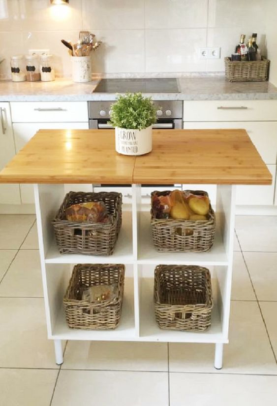 an open kitchen island with baskets is great for storage and for cooking or other stuff you wanna do with it