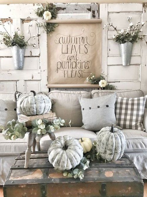 chalk paint pumpkins, greenery and white blooms to create a vintage farmhouse space with neutral decor