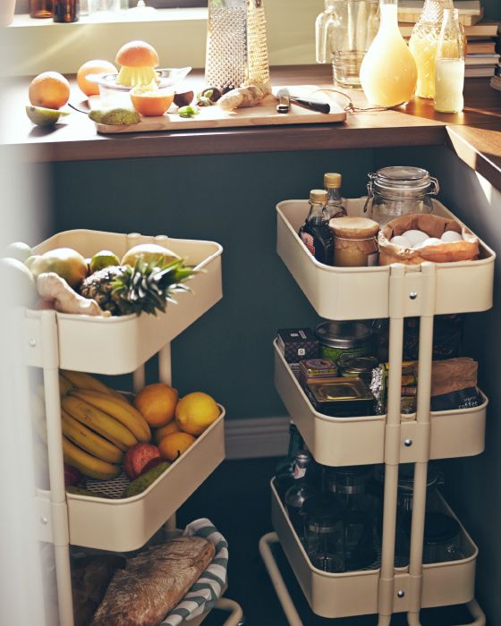 mini kitchen carts placed under the windowsill are great for storing anything you want