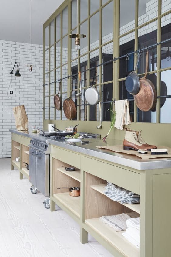 open storage cabinets and railing with pans and pots hanging over them are nice for every kitchen