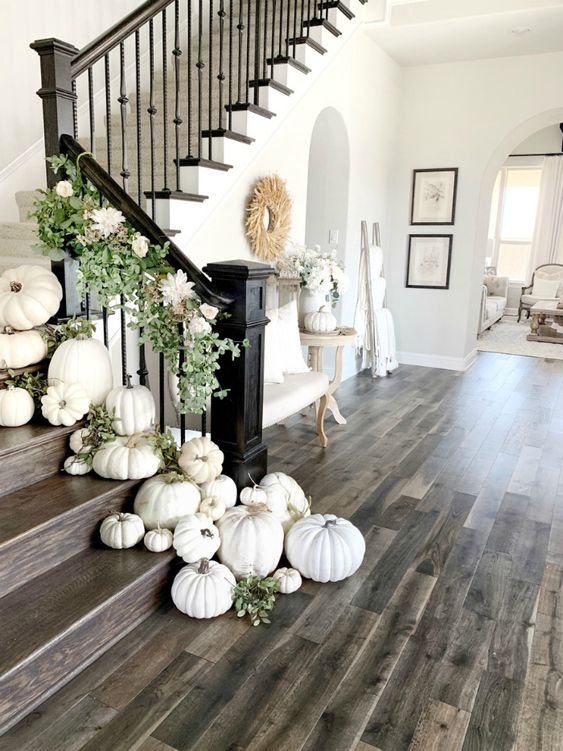 styling the staircase with white pumpkins, greenery and fresh white blooms is very refined and gorgeous