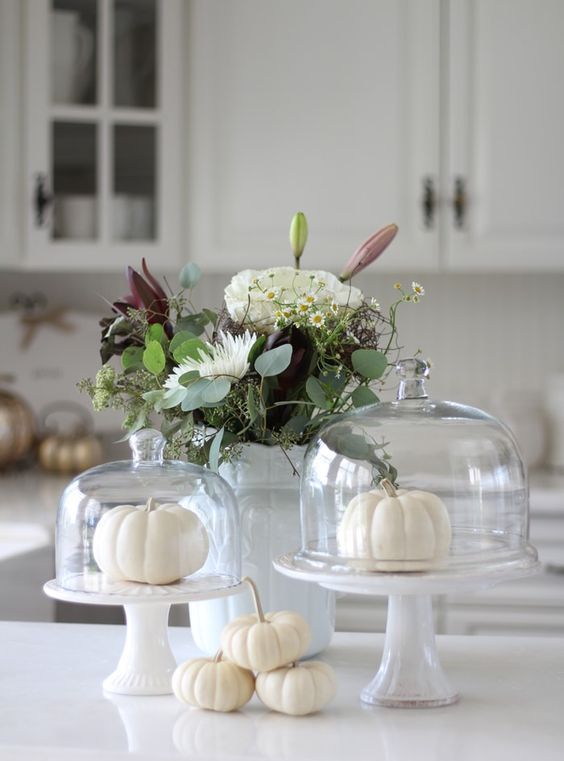 white pumpkins on the table and in a cloche, a lush and neutral floral arrangement in a vase for fall decor