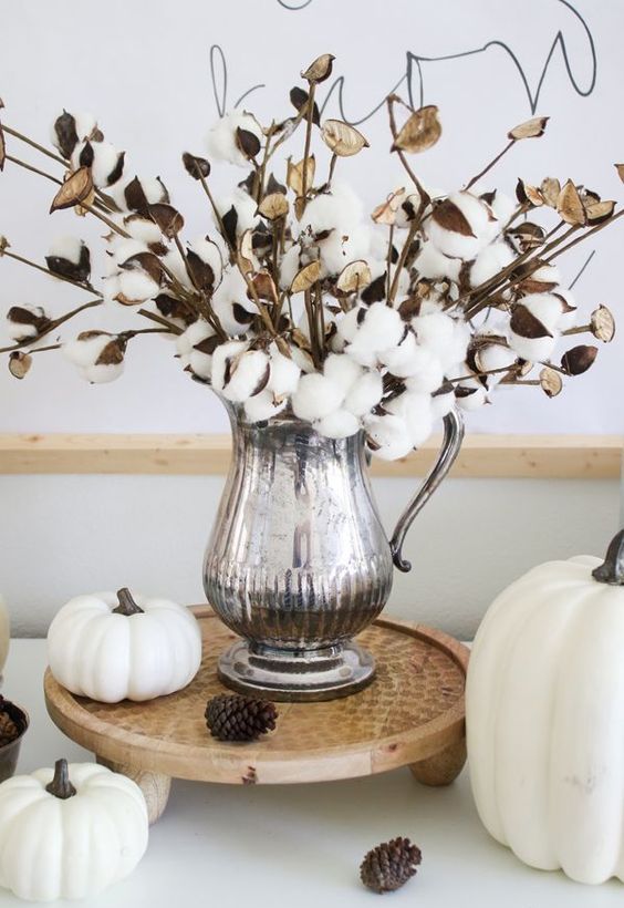 white pumpkins, pinecones and a cotton arrangement in a silver jug for elegant and chic fall decor