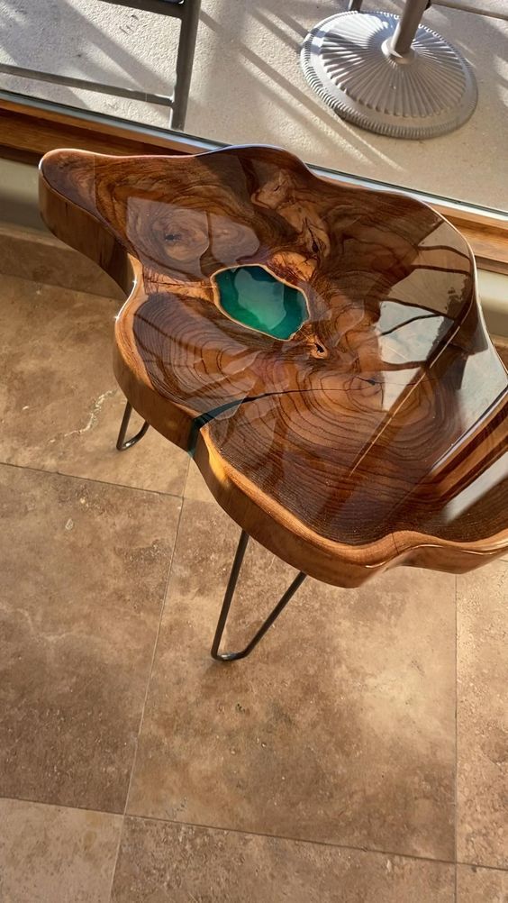 a beautiful wood slice coffee table with an emerald insert and hairpin legs is a stylish idea for any modern space