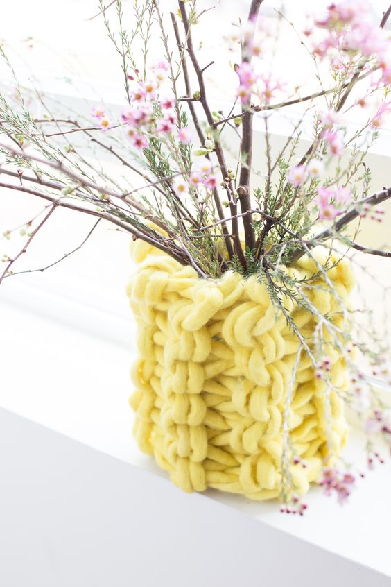 a bold yellow chunky knit cover for a planter or a vase is a great idea to make your planters lovely, not only for the fall