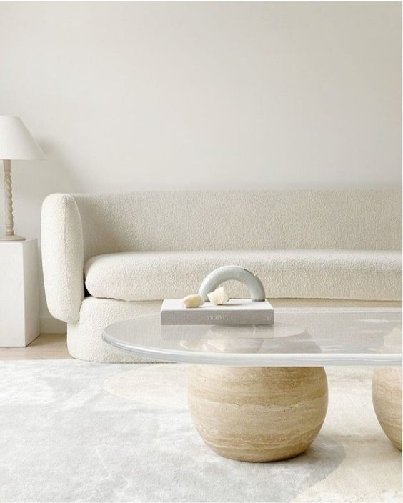 a catchy modern coffee table of stone balls and an acrylic tabletop will become a sculptural touch to your space