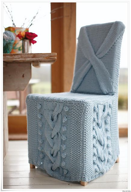 a chair covered with powder blue knit is very chic and cool and will finish off a vintage or rustic space