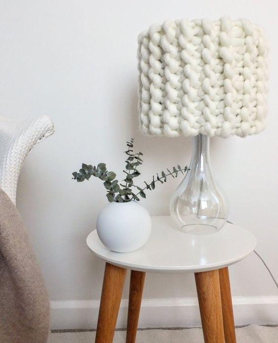 a classy Scandinavian table lamp with a clear glass base and a white chunky knit lampshade is a lovely idea