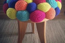 a colorful crochet stool with a ball-like seat is a fun and whimsy idea to rock in your space