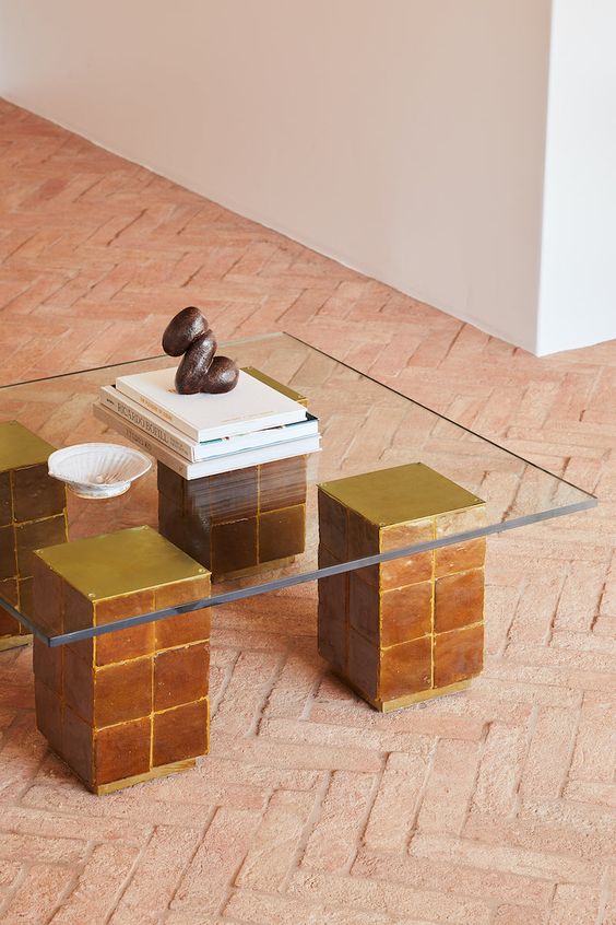 a cool coffee table with legs clad with Zellige tables and a clear glass tabletop will match a modern space with a Moroccan or boho feel