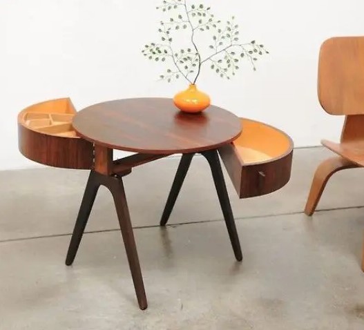 a creative round rich-stained mid-century modern coffee table on tall legs and with semi circle drawers is a very stylish idea