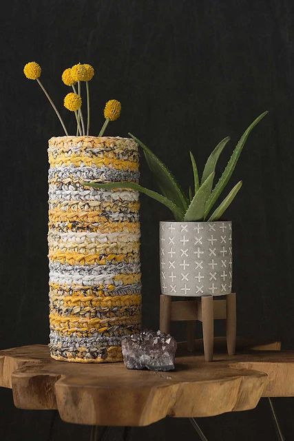 a gorgeous bold cozy for a vase made of rag yarn in bright colors is a fantastic idea to add color to the interior