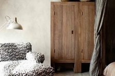 a gorgeous vintage lounger with a chunky knit cover is a all you need to relax during cold days