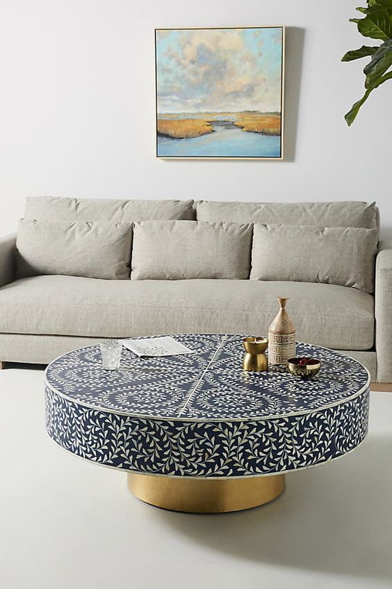 a gorgeous white, navy and brass inlay coffee table will bring a touch of Eastern luxury to your space