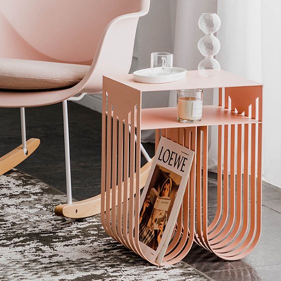 a lovely modern coffee table of curved metal legs and a tiered tabletop will provide some storage space and will make the space bolder