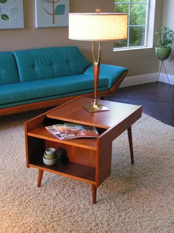 a lovely rich-stained mid-century modern coffee table with open storage compartments is a good idea for a nightstand, too
