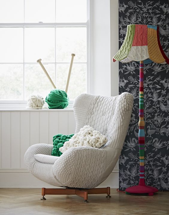 a modern chair covered with a neutral patterned crochet cover looks very cozy and lovely and will welcome you