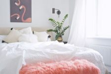 a pink faux fur bench adds color to the space and brings much texture to it making it more welcoming