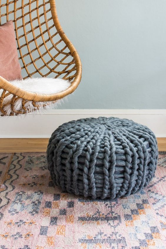 a pouf covered with grey chunky knit is a great addition to your space, the chunky look will add texture