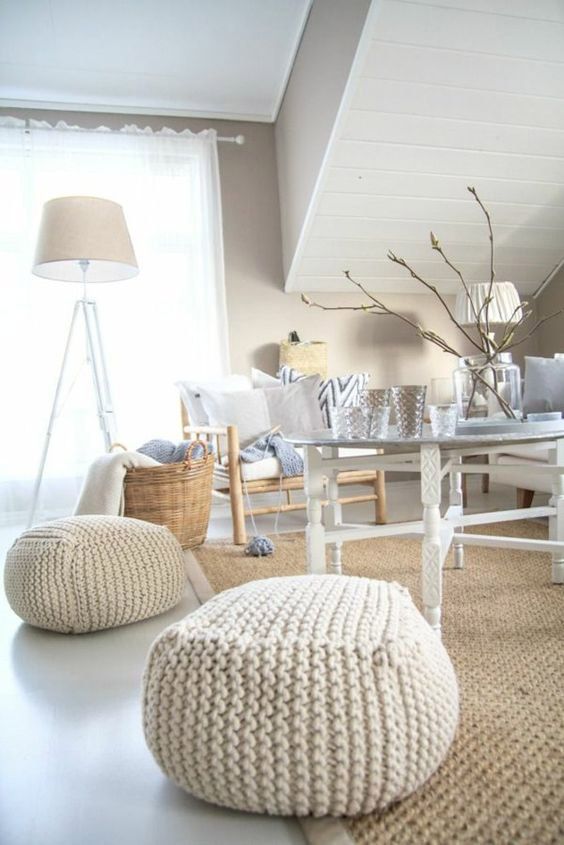 a poufs covered with neutral chunky knit covers are a great addition for many interiors, from Scandinavian to modern ones
