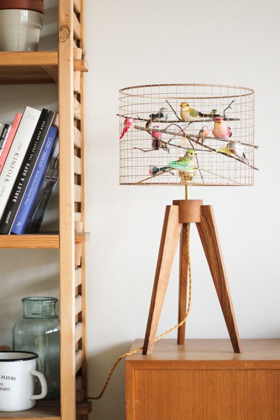 a quirky copper bird cage table lamp with lots of faux birds is a fun and cheerful idea for any space
