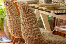 chairs covered with chunky crochet covers are amazing for cozying up the space, add mug cozies in the same style
