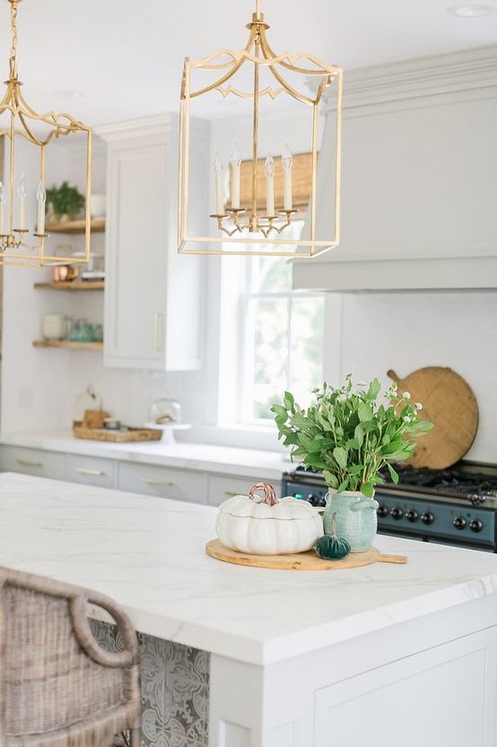 chic and elegant modern takes on traditional candle chandeliers with framing bring a wow effect to the space