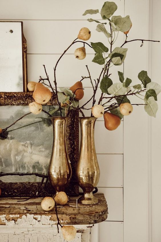 metallic vases with pear branches is a stylish fall decoration with a rustic feel