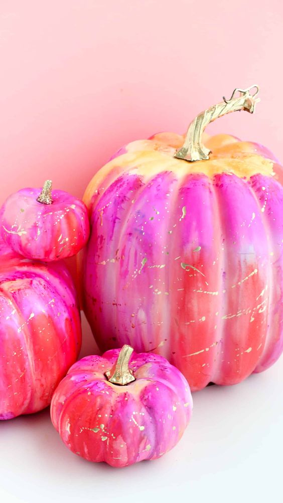 super colorful ombre pumpkins in red, pink and yellow and with gold splashes are fun and bright