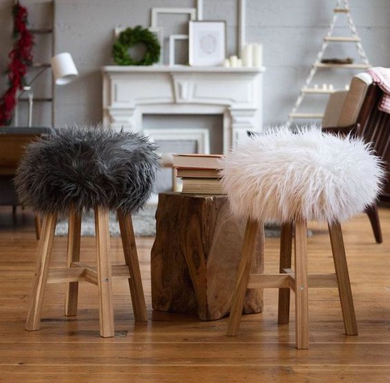 wooden stools with faux fur covers are very cozy and very welcoming during cold months