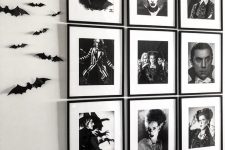 a black and white grid gallery wall and black bats on the wall will give a cool Halloween feel to the space
