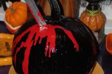 a stylish black-red halloween pumpkin centerpiece