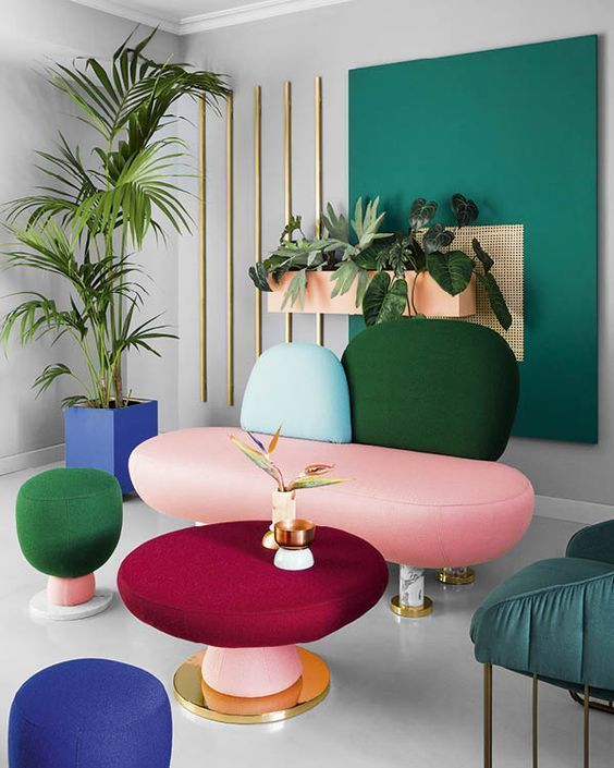 a creative and colorful loveseat with tall legs makes a color block statement in the space and perfectly makes an accent
