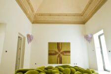 a super creative green nest-inspried woven sofa welcomes and invites to lie on it and relax a lot