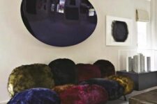a whimsical dark-colored faux fur sofa that seems to be composed of separate pompoms is a fantastic idea