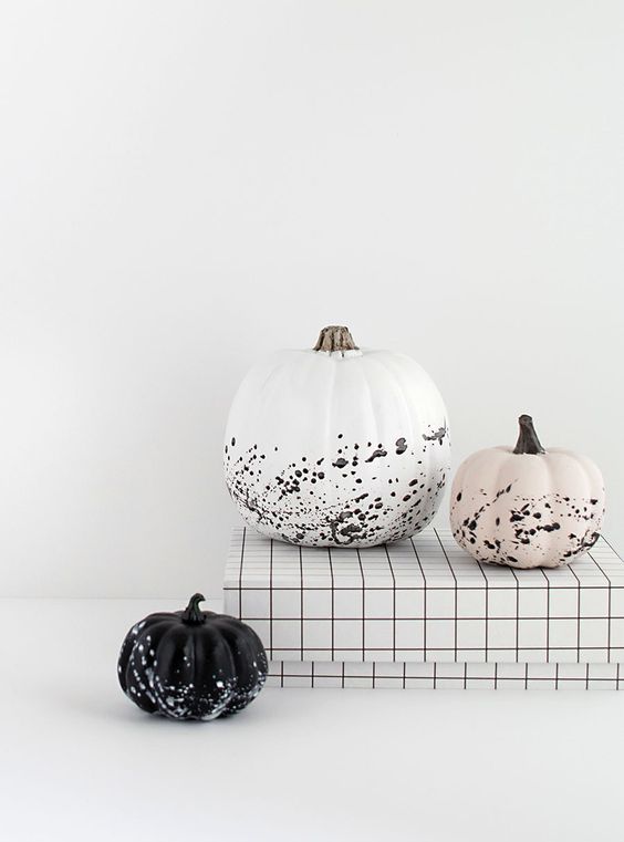 gorgeous minimalist Halloween pumpkins - a white, black and blush one with splatters are awesome