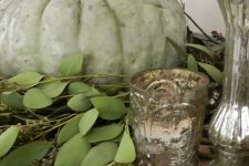 greenery, a green pumpkins and mercury glass candleholders for chic vintage and rustic Thanksgiving decor