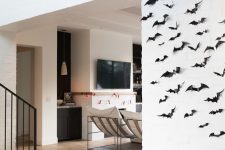 minimalist Halloween decor with black paper bats on the wall is eays to make last minute and looks cool and lovely