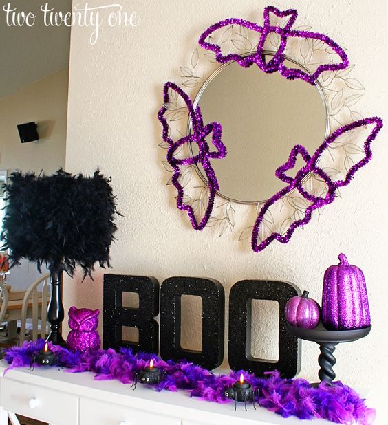 purple Halloween bat silhouettes, feathers, an owl and pumpkins are great for styling your mantel for Halloween