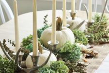 rustic Thanksgiving decor with hydrangeas, antlers, candles and white pumpkins is very pretty and chic