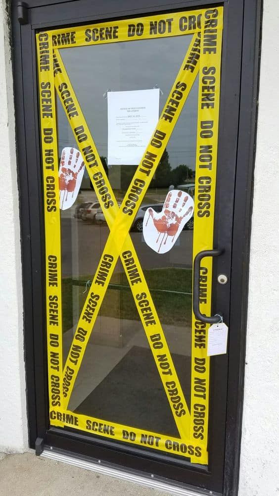 style your front door or some other doors like a crime scene - this is an easy and cool  decor idea for Halloween