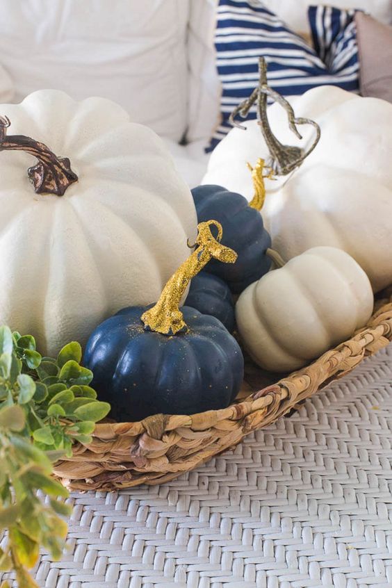 a basket with white and navy pumpkins will make a chic Thanksgiving centerpiece or just a decoration