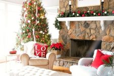 a bright holiday living room with a Christmas tree decorated with red and white ornaments, with a matching garland, red pillows and ornaments